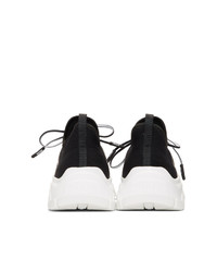 Sneakers basse nere e bianche di Prada