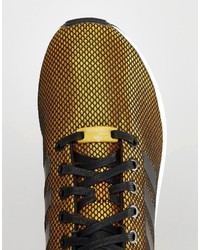 Sneakers dorate di adidas