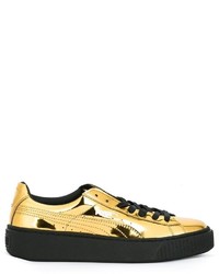 Sneakers dorate di Puma