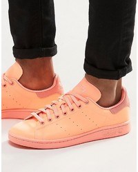 Sneakers in pelle arancioni di adidas