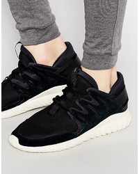 Sneakers in pelle nere di adidas