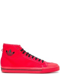 Sneakers in pelle rosse di Adidas By Raf Simons