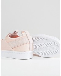 Sneakers senza lacci rosa di adidas
