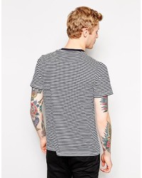 T-shirt girocollo a righe orizzontali bianca e nera di Fred Perry