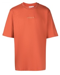 T-shirt girocollo arancione di adidas