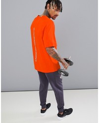 T-shirt girocollo arancione di Calvin Klein Performance
