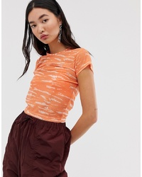 T-shirt girocollo effetto tie-dye arancione di ASOS DESIGN