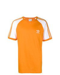 T-shirt girocollo stampata arancione di adidas