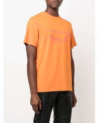 T-shirt girocollo stampata arancione di Martine Rose