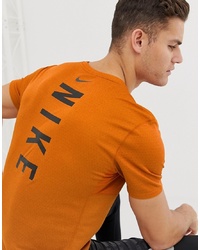 T-shirt girocollo stampata arancione di Nike Running