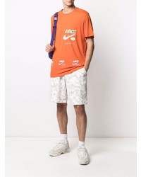 T-shirt girocollo stampata arancione di Nike