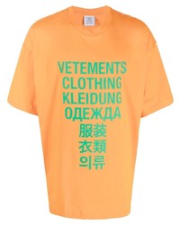 T-shirt girocollo stampata arancione di Vetements